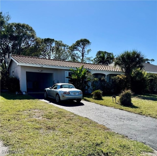 view of front facade with a garage and a front yard