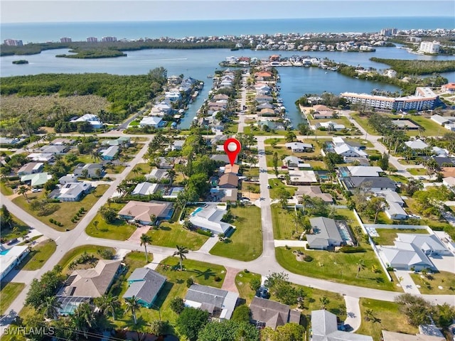 birds eye view of property featuring a water view