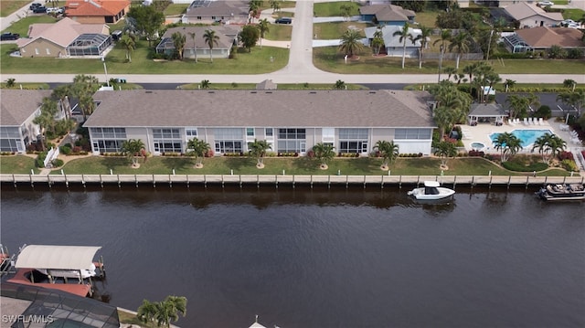 bird's eye view with a residential view and a water view