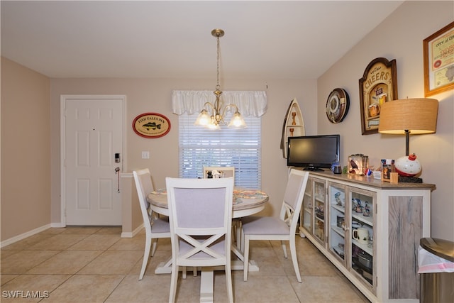 dining room with a chandelier and light tile patterned flooring