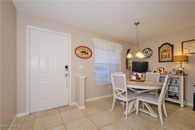 dining space with an inviting chandelier and light tile patterned floors