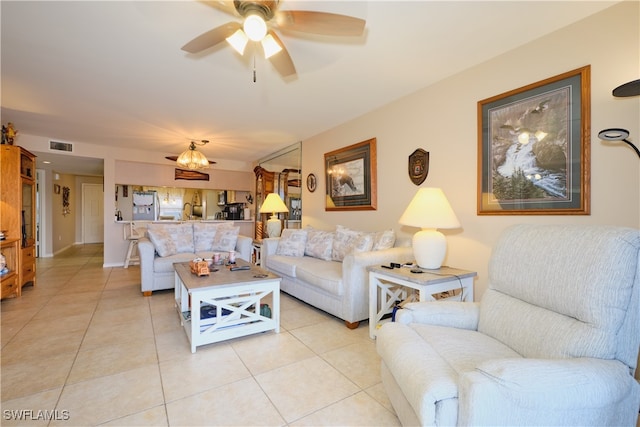 living room with light tile patterned floors and ceiling fan