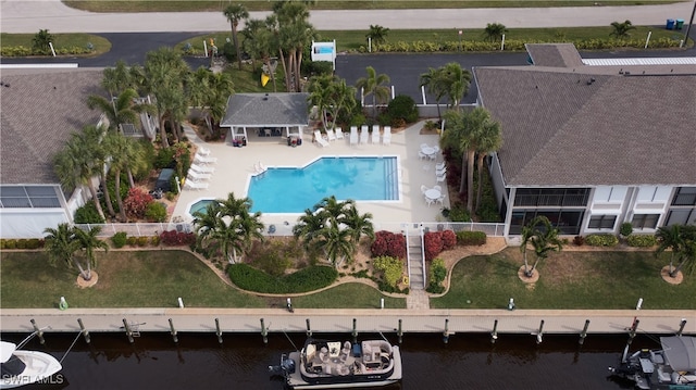 birds eye view of property featuring a water view