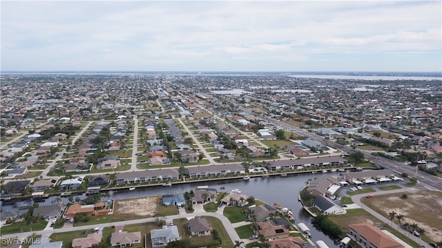 birds eye view of property featuring a residential view and a water view