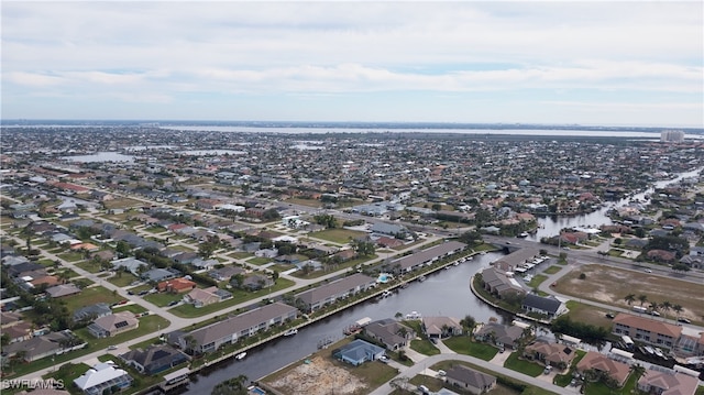 bird's eye view featuring a residential view and a water view