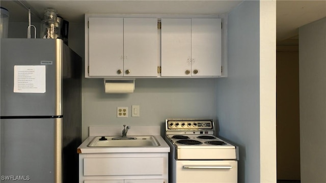 clothes washing area with sink