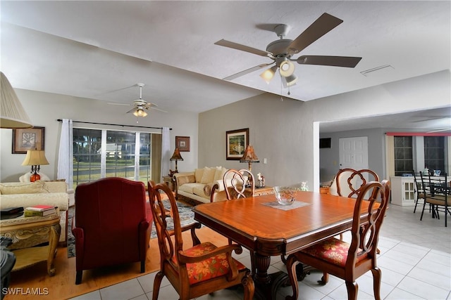 dining area featuring ceiling fan and light tile patterned flooring