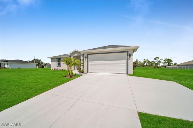 single story home featuring a garage and a front yard