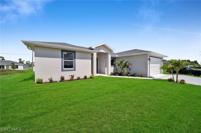 view of front facade with a front yard and a garage