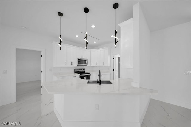 kitchen featuring sink, stainless steel appliances, kitchen peninsula, decorative light fixtures, and white cabinets