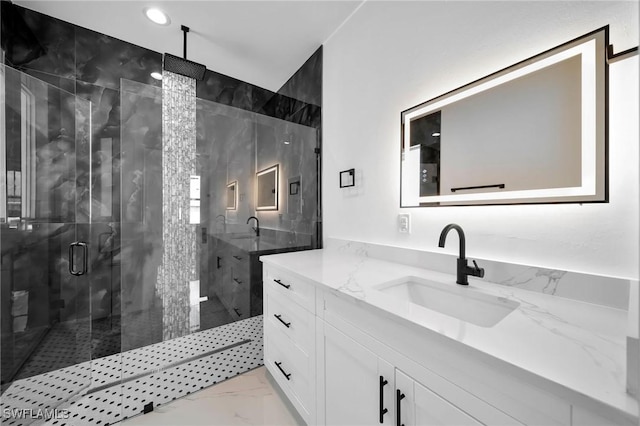 bathroom featuring vanity and walk in shower