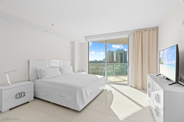 tiled bedroom featuring access to outside