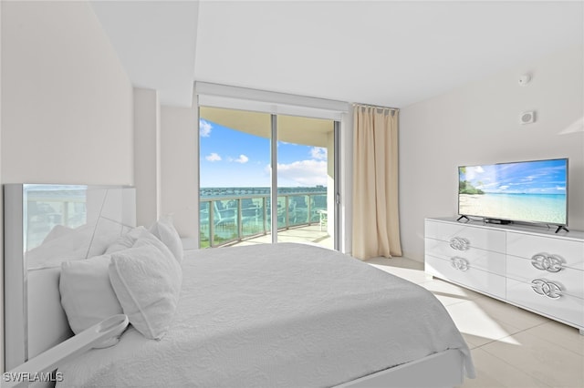 tiled bedroom with access to exterior and multiple windows