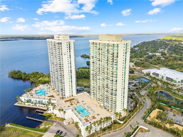 birds eye view of property with a water view