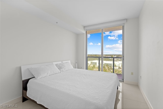 bedroom featuring light tile patterned floors