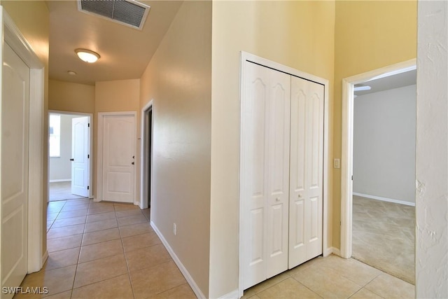 hallway featuring light tile patterned floors