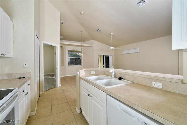 kitchen featuring ceiling fan with notable chandelier, white appliances, vaulted ceiling, white cabinetry, and hanging light fixtures