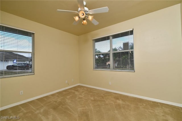 carpeted empty room with ceiling fan