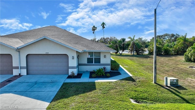 ranch-style home with a front yard and a garage