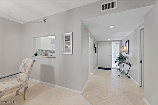 hallway featuring light tile patterned floors