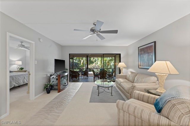 living room featuring ceiling fan and light colored carpet