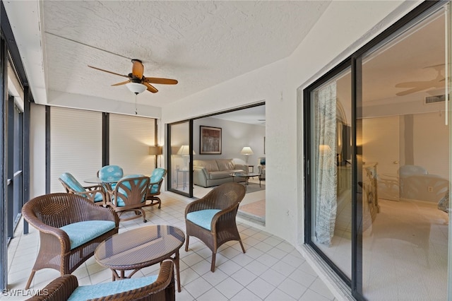 sunroom / solarium with ceiling fan