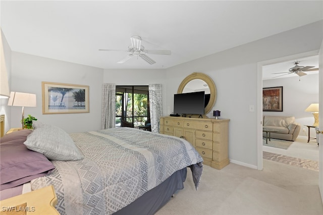 carpeted bedroom with ceiling fan and access to exterior