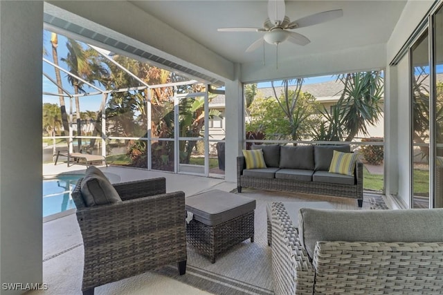 sunroom with ceiling fan and a wealth of natural light