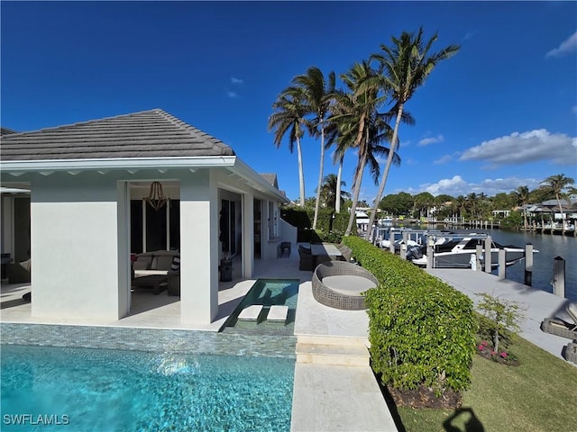 pool featuring a patio and a boat dock