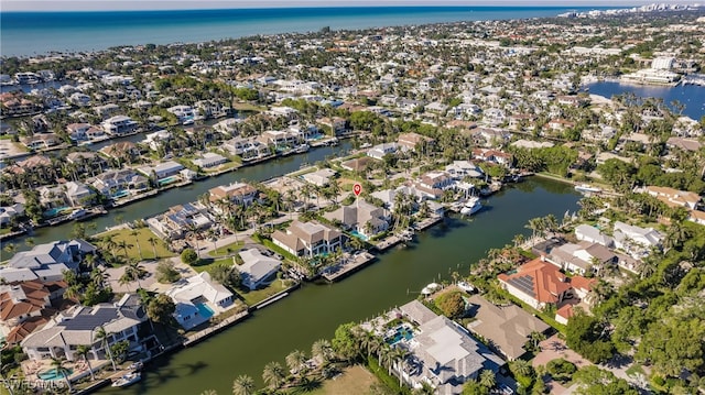 bird's eye view featuring a water view and a residential view