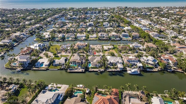 bird's eye view featuring a water view and a residential view