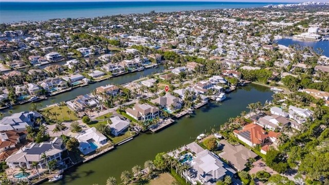 birds eye view of property featuring a residential view and a water view