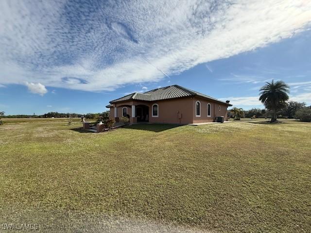 view of property exterior featuring a yard