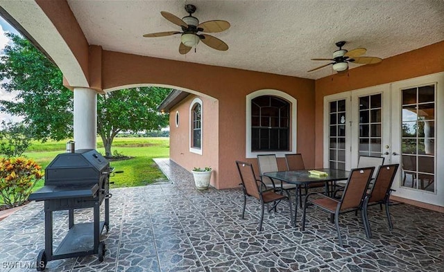 view of patio with french doors and ceiling fan