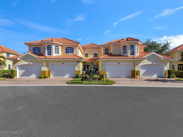 mediterranean / spanish house featuring a garage