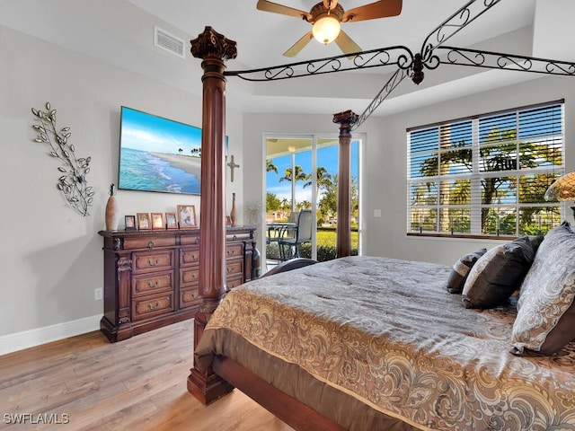 bedroom featuring access to exterior, ceiling fan, and light wood-type flooring