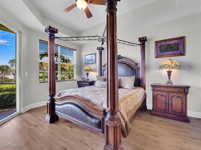 bedroom featuring access to exterior, ceiling fan, baseboards, and wood finished floors