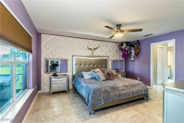 bedroom featuring ceiling fan and light tile patterned floors