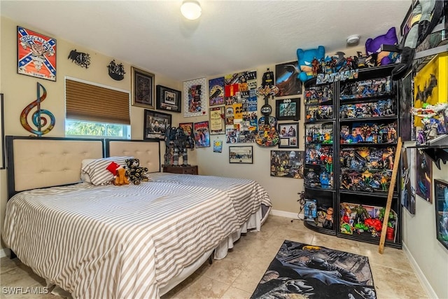 bedroom with light tile patterned floors