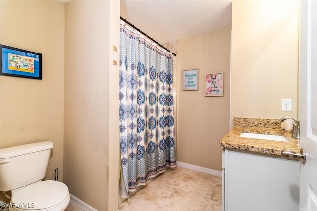 bathroom with walk in shower, tile patterned floors, vanity, and toilet