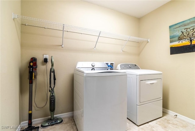 washroom with separate washer and dryer