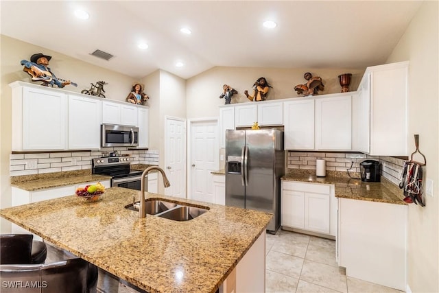 kitchen featuring a kitchen island with sink, sink, white cabinets, and appliances with stainless steel finishes