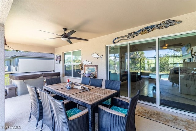 view of patio / terrace featuring a hot tub, ceiling fan, and a grill