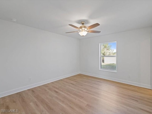 unfurnished room featuring ceiling fan and light hardwood / wood-style flooring