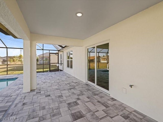 view of patio / terrace with a lanai