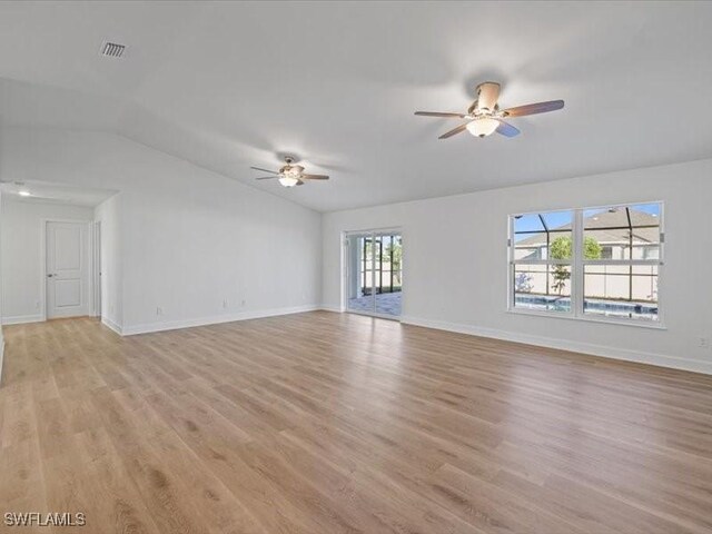 unfurnished living room featuring light wood-type flooring, ceiling fan, and lofted ceiling