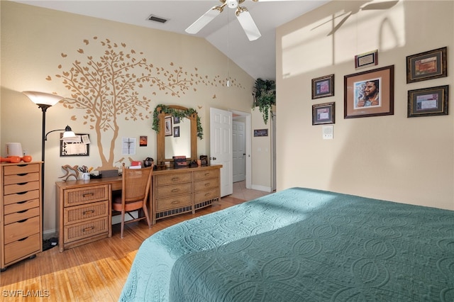 bedroom featuring light hardwood / wood-style floors, ceiling fan, and lofted ceiling