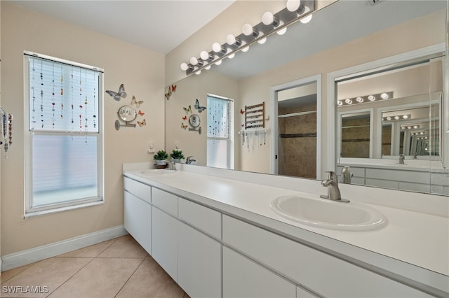 bathroom with vanity, tile patterned floors, and curtained shower