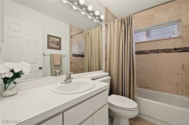 full bathroom with toilet, vanity, and shower / tub combo with curtain