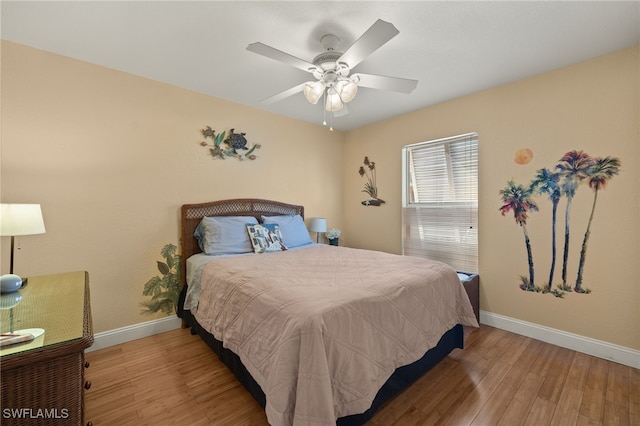 bedroom featuring ceiling fan and light hardwood / wood-style floors